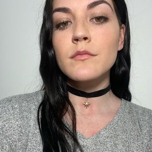 Black choker with golden star pendant